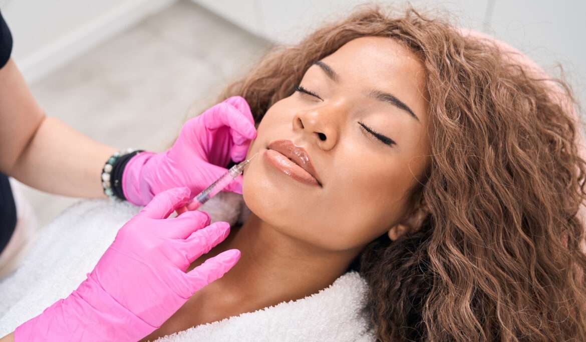Curly-haired woman cosmetic dermatology procedure