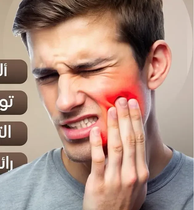 Man holding cheek in tooth pain.