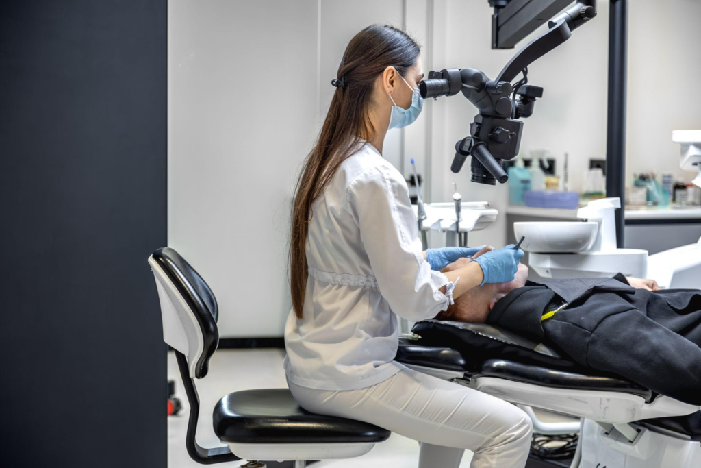 A female dentist diagnosing the patient in a chair 