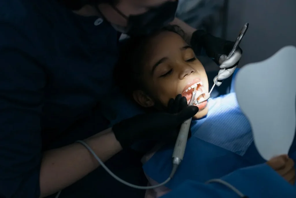 Child undergoing dental treatment