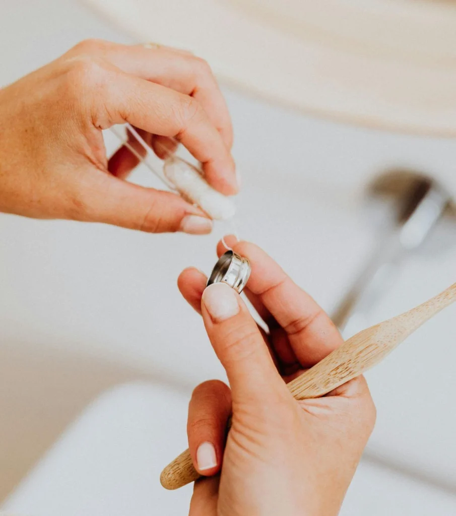 Close-up of toothbrush and floss showing the best way to remove plaque from teeth at home_png
