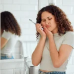 young lady with dental pain